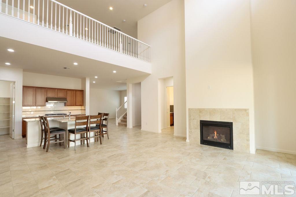 9410 Stony Hill Road Reno, NV 89521 - Photo 19 of 39 a dining room with furniture and a fireplace