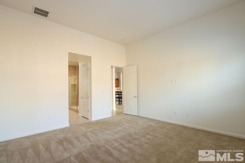9410 Stony Hill Road Reno, NV 89521 - Photo 21 of 39 an empty room with closet and bathroom