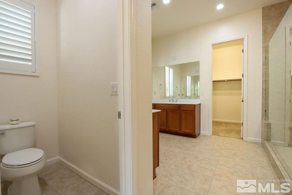 9410 Stony Hill Road Reno, NV 89521 - Photo 23 of 39 a bathroom with a sink and a toilet