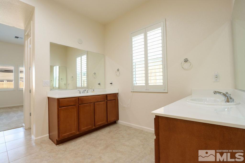 9410 Stony Hill Road Reno, NV 89521 - Photo 24 of 39 a spacious bathroom with a sink and a mirror
