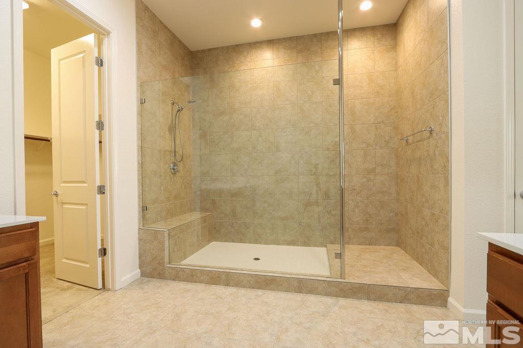 9410 Stony Hill Road Reno, NV 89521 - Photo 26 of 39 a bathroom with a shower and a tub