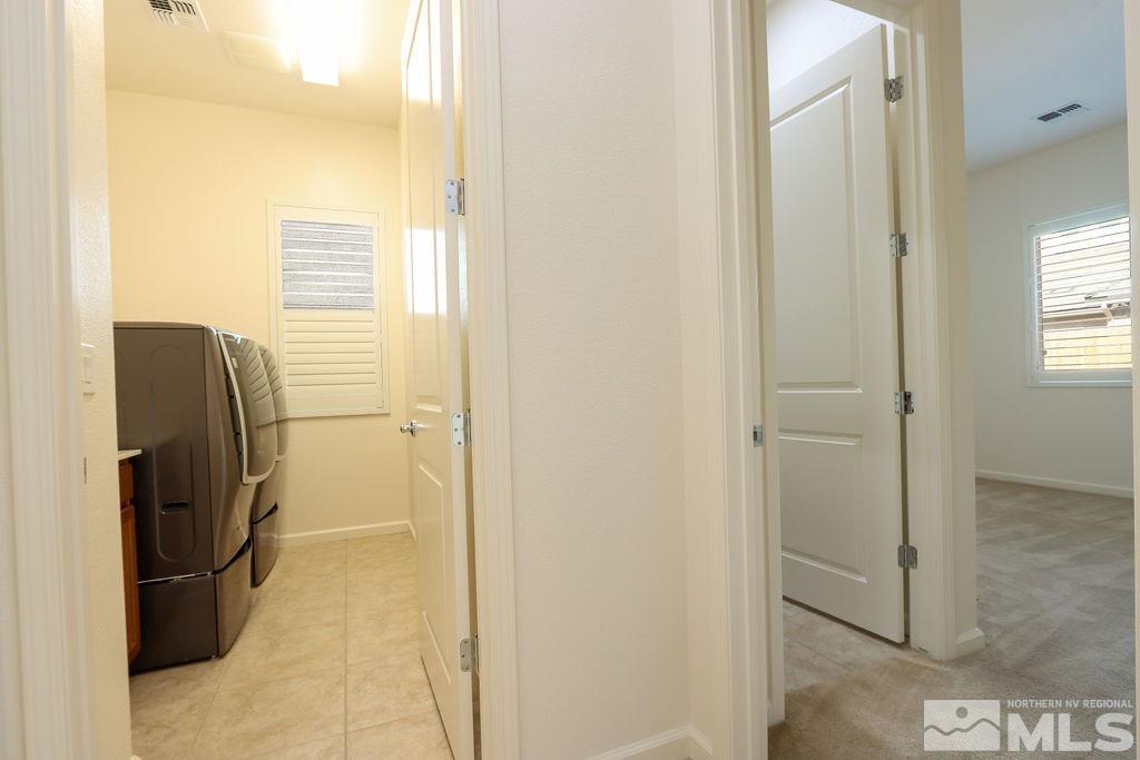 9410 Stony Hill Road Reno, NV 89521 - Photo 29 of 39 a view of a bathroom from a corridor
