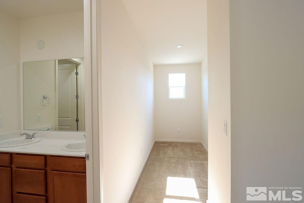 9410 Stony Hill Road Reno, NV 89521 - Photo 35 of 39 a bathroom with a sink and a mirror