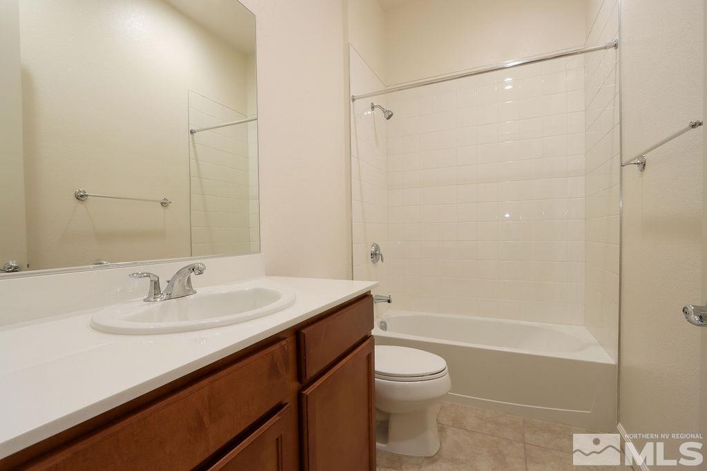 9410 Stony Hill Road Reno, NV 89521 - Photo 36 of 39 a bathroom with a sink a toilet and shower