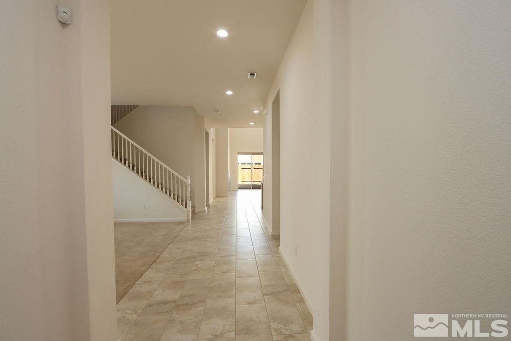 9410 Stony Hill Road Reno, NV 89521 - Photo 8 of 39 a view of a hallway with stairs