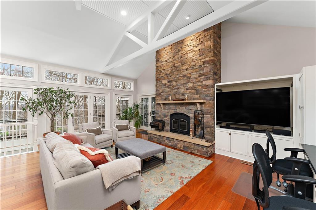 401 Redgate Road Sewickley, PA 15143 - Photo 14 of 50 a living room with furniture a flat screen tv and a fireplace