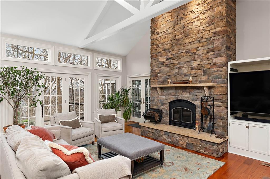 401 Redgate Road Sewickley, PA 15143 - Photo 15 of 50 a living room with furniture a flat screen tv and a fireplace