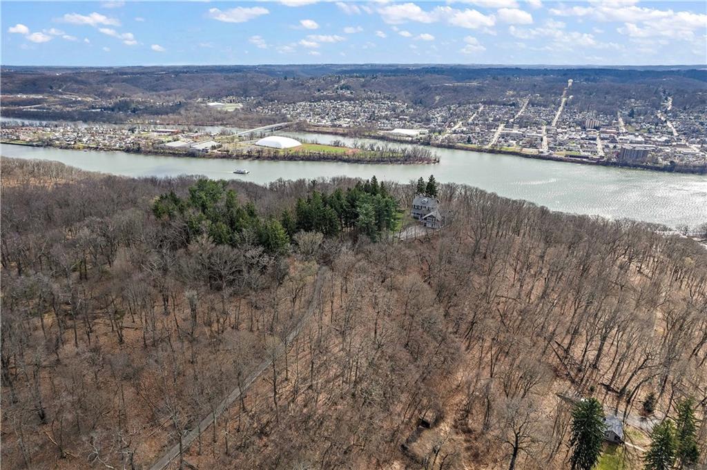 401 Redgate Road Sewickley, PA 15143 - Photo 2 of 50 a view of a lake with a mountain