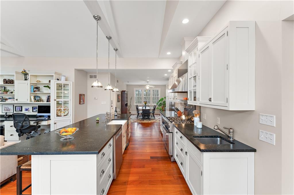 401 Redgate Road Sewickley, PA 15143 - Photo 24 of 50 a large kitchen with stainless steel appliances granite countertop a lot of counter space and wooden floors