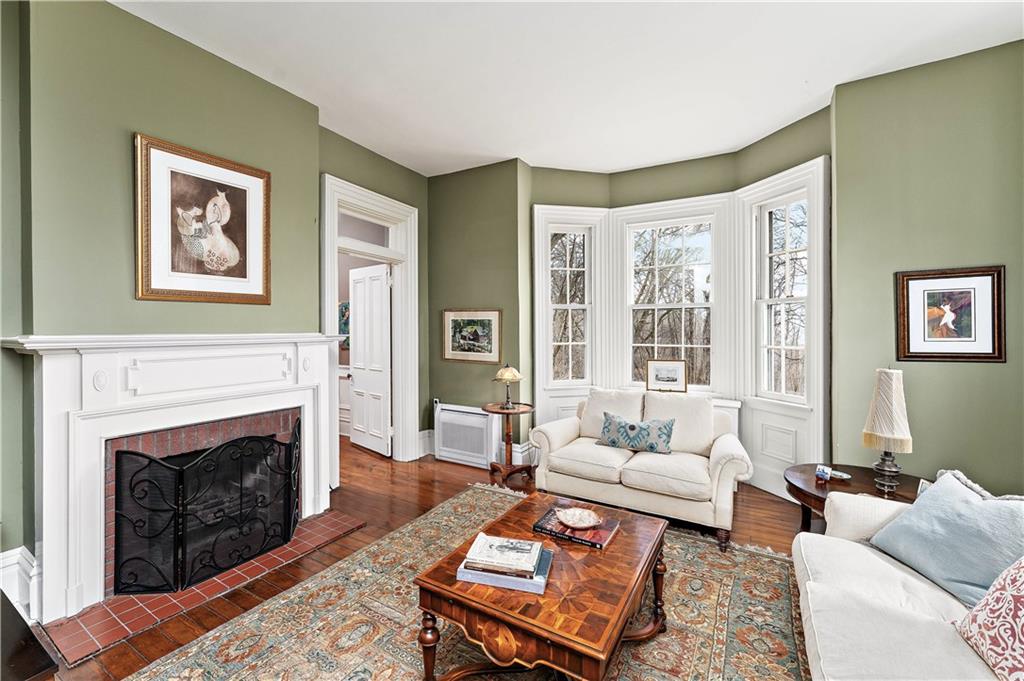 401 Redgate Road Sewickley, PA 15143 - Photo 29 of 50 a living room with furniture a rug and a fireplace
