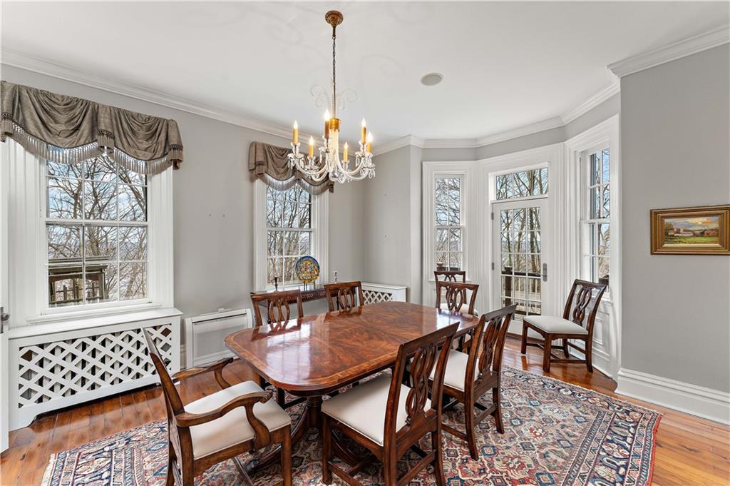 401 Redgate Road Sewickley, PA 15143 - Photo 33 of 50 a view of a dining room with furniture a chandelier and wooden floor