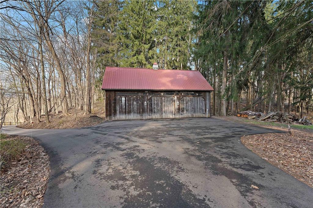 401 Redgate Road Sewickley, PA 15143 - Photo 6 of 50 a front view of a house with a yard and tree s