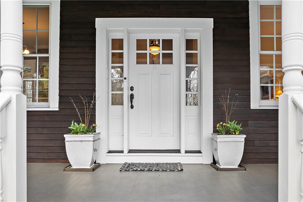 401 Redgate Road Sewickley, PA 15143 - Photo 7 of 50 a view of a house door with a potted plant