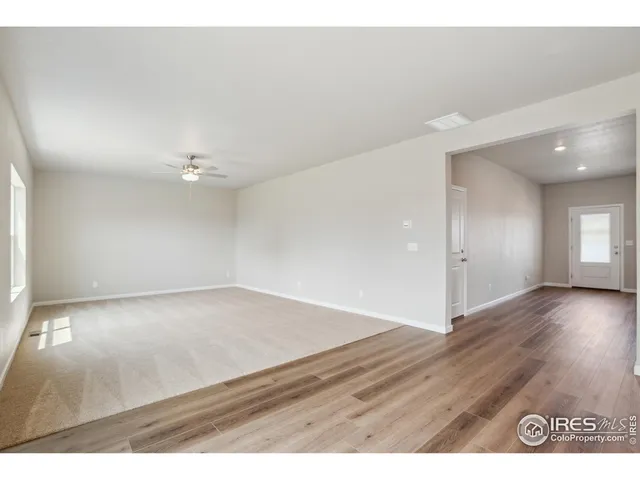 a view of an empty room and window