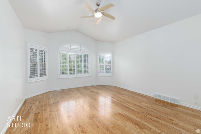 2327 Bluff Ridge Drive Syracuse, UT 84075 - Photo 21 of 66 Bright room featuring wood-finish flooring, a vaulted ceiling, and a ceiling fan