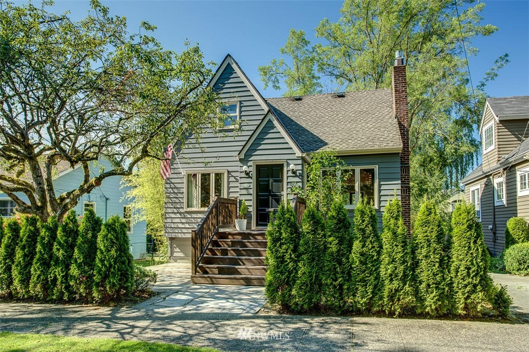 1612 East McGraw Street Seattle, WA 98112 - Photo 1 of 21 a front view of a house with a garden