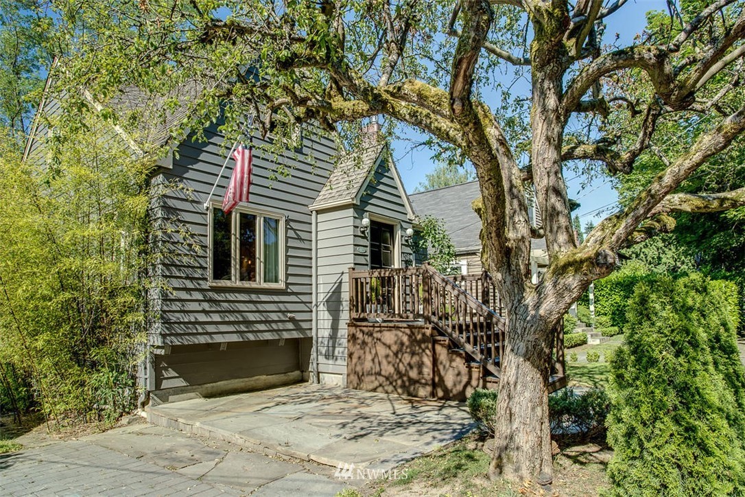 1612 East McGraw Street Seattle, WA 98112 - Photo 2 of 21 a view of a house with a tree in the yard
