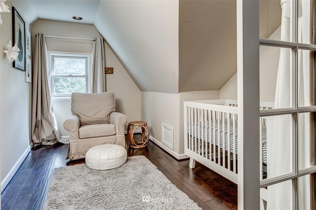 1612 East McGraw Street Seattle, WA 98112 - Photo 16 of 21 a living room with furniture and a window