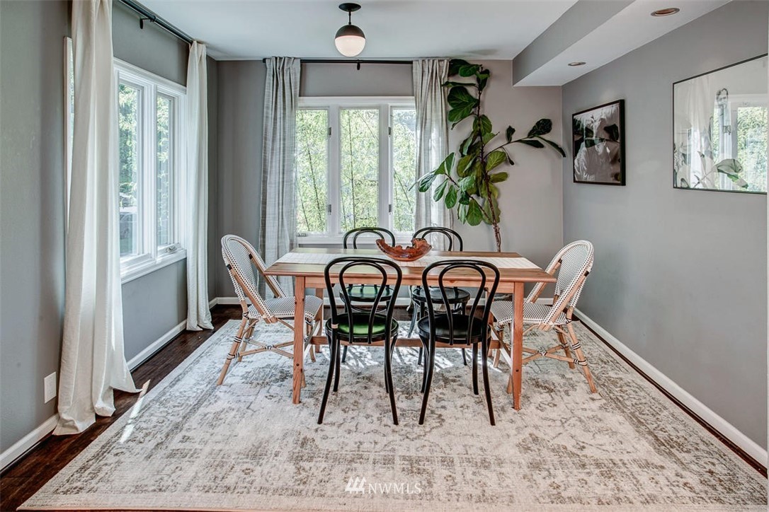 1612 East McGraw Street Seattle, WA 98112 - Photo 5 of 21 a view of a dining room with furniture window and wooden floor