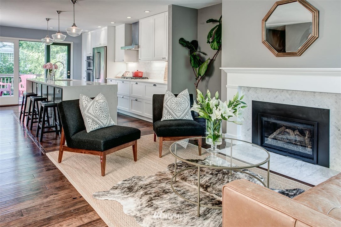 1612 East McGraw Street Seattle, WA 98112 - Photo 6 of 21 a living room with furniture and a fireplace
