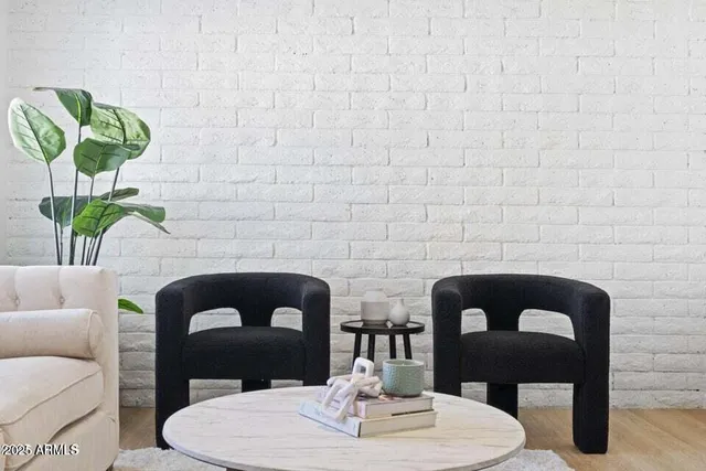 a front view of a house with dining table and chairs