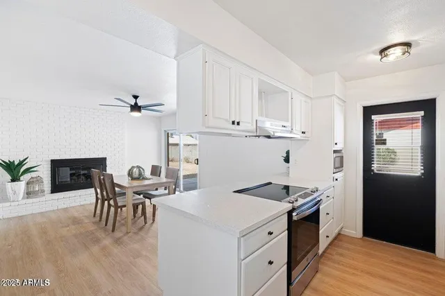 a kitchen with a table chairs and a stove