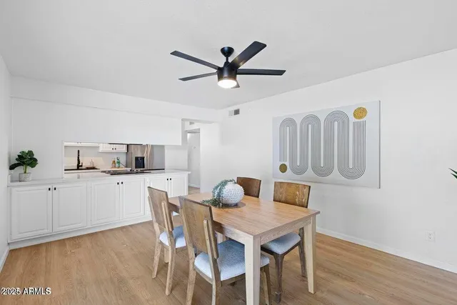 a kitchen with a table and chairs in it