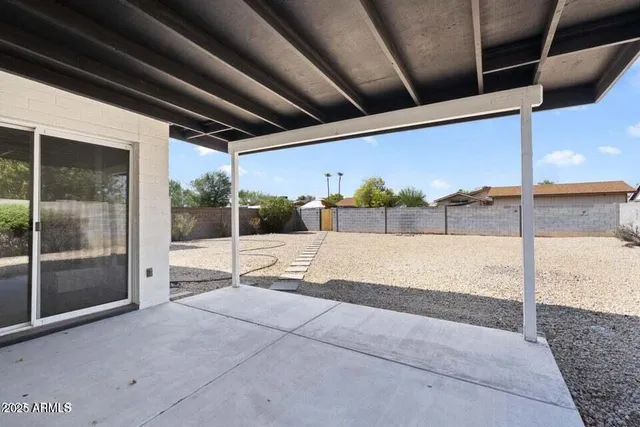 a view of a backyard of the house