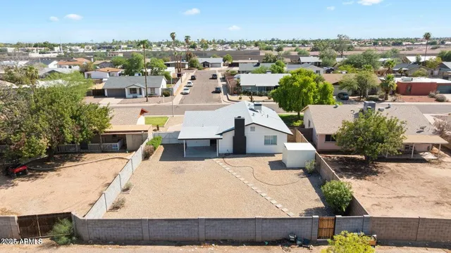 an aerial view of residential houses with outdoor space