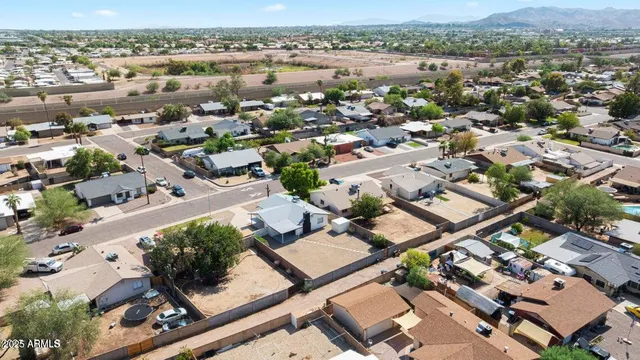 an aerial view of residential building with green space