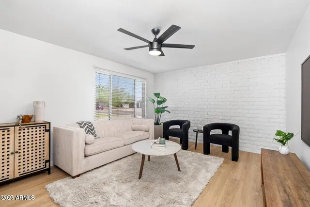 a living room with furniture and a rug