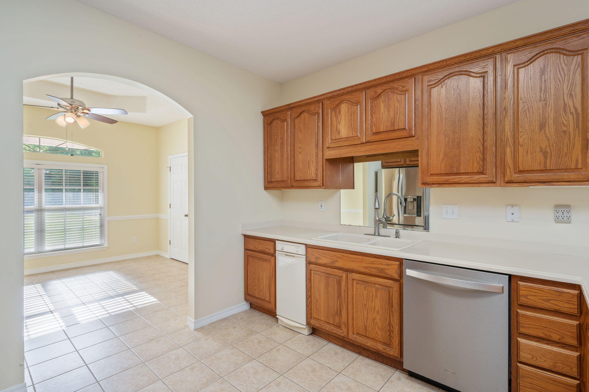 5552 Frontier Drive Crestview, FL 32536 - Photo 16 of 50 a kitchen with a sink dishwasher stove and cabinets