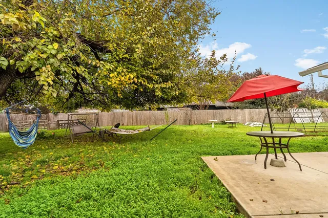 swimming pool view with a seating space