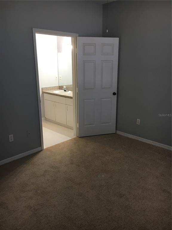 6304 Raleigh Street, Unit 204 Orlando, FL 32835 - Photo 17 of 29 a view of an empty room with a window