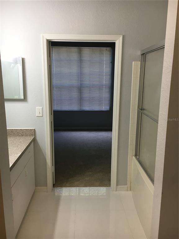 6304 Raleigh Street, Unit 204 Orlando, FL 32835 - Photo 18 of 29 a bathroom with a shower