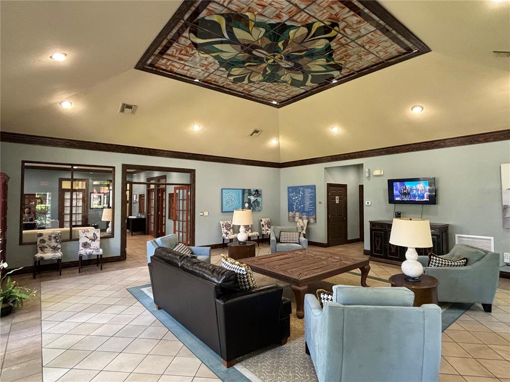 6304 Raleigh Street, Unit 204 Orlando, FL 32835 - Photo 24 of 29 a living room with furniture and large window