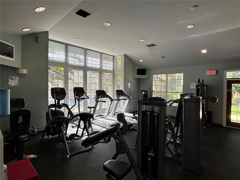 6304 Raleigh Street, Unit 204 Orlando, FL 32835 - Photo 28 of 29 a view of a a dining room with furniture window and wooden floor