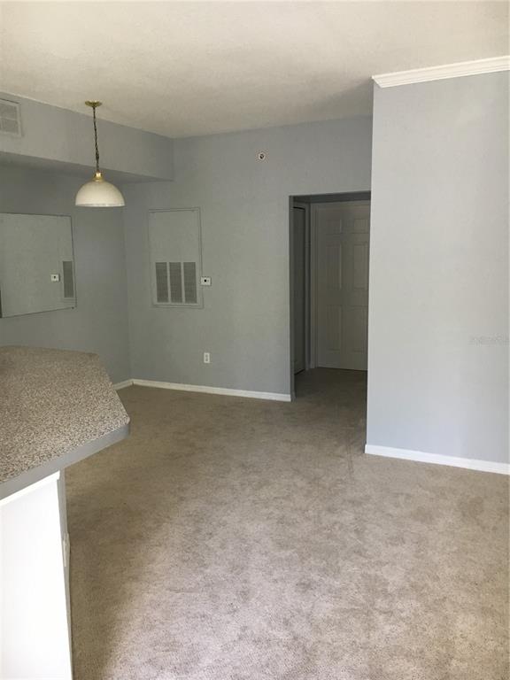 6304 Raleigh Street, Unit 204 Orlando, FL 32835 - Photo 6 of 29 a view of an empty room with a window