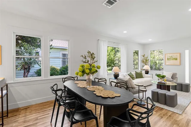 a view of a dining room with furniture window and outside view
