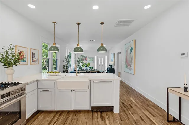 a open kitchen with sink and stove