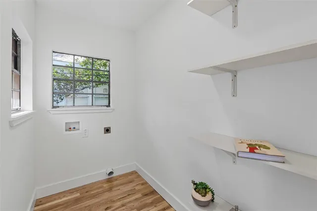 a view of room with hardwood floor and window