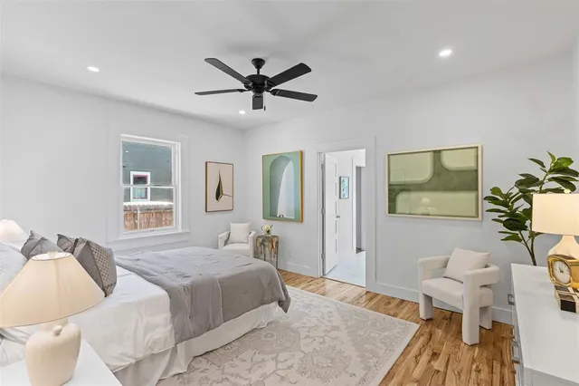 a bedroom with a bed and a couch