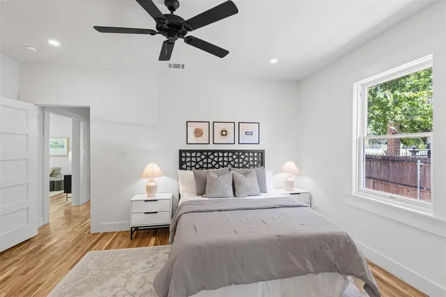 a bedroom with a large bed and a window