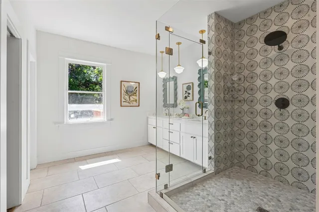 a bathroom with a bathtub sink and mirror