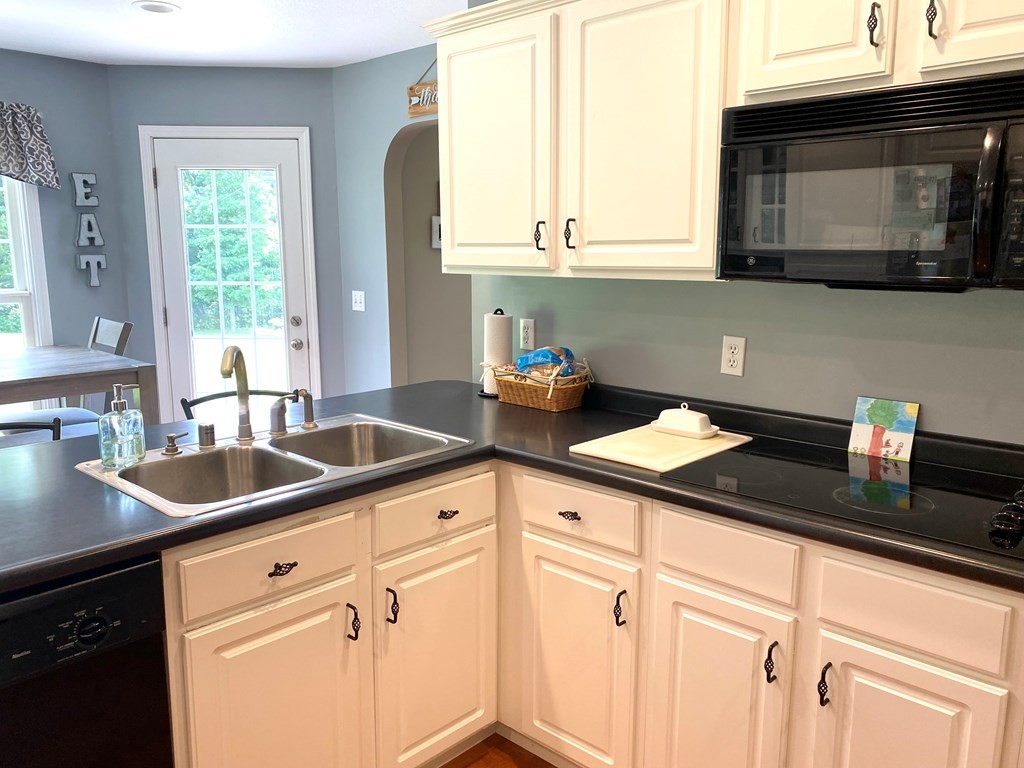 210 Clarks Store Sinking Fork Road Cerulean, KY 42215 - Photo 11 of 45 a kitchen with stainless steel appliances granite countertop white cabinets and a sink
