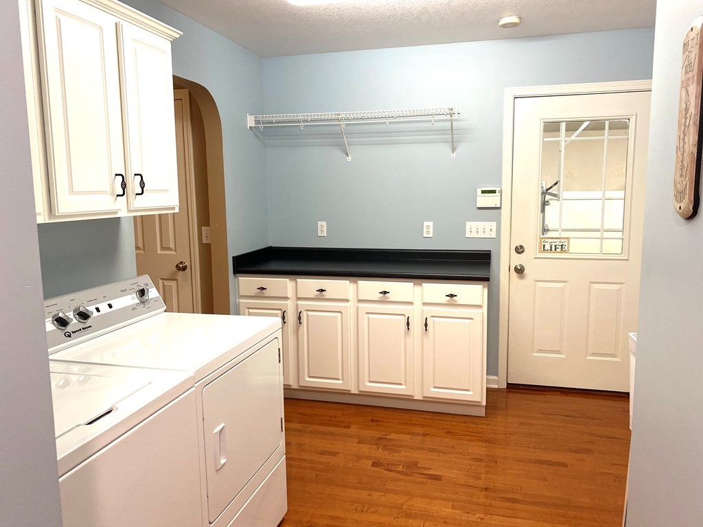 210 Clarks Store Sinking Fork Road Cerulean, KY 42215 - Photo 16 of 45 a view of washer and dryer with wooden floor