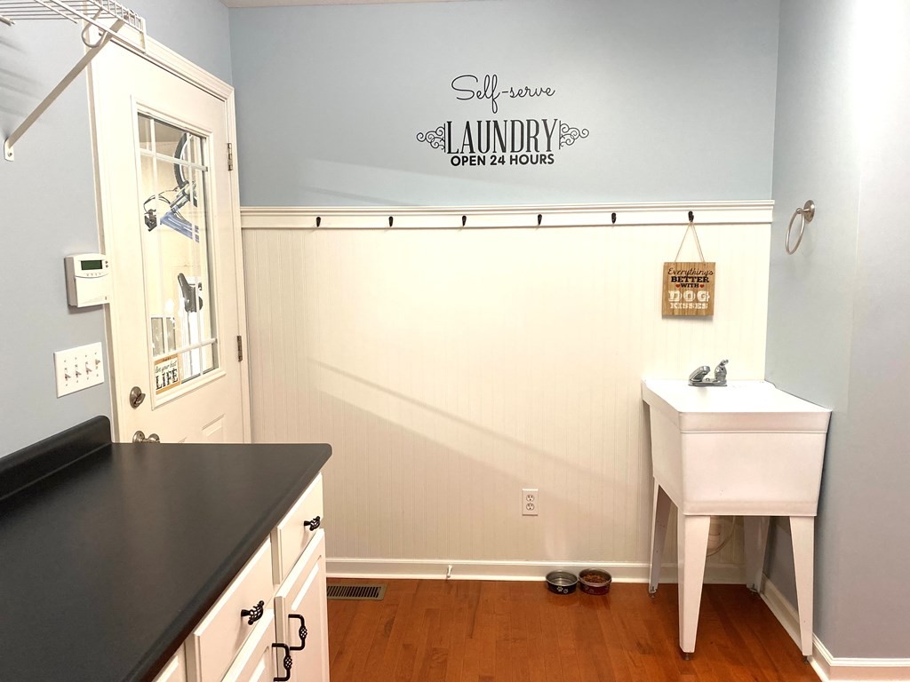 210 Clarks Store Sinking Fork Road Cerulean, KY 42215 - Photo 18 of 45 a view of a kitchen with fridge and wooden floor