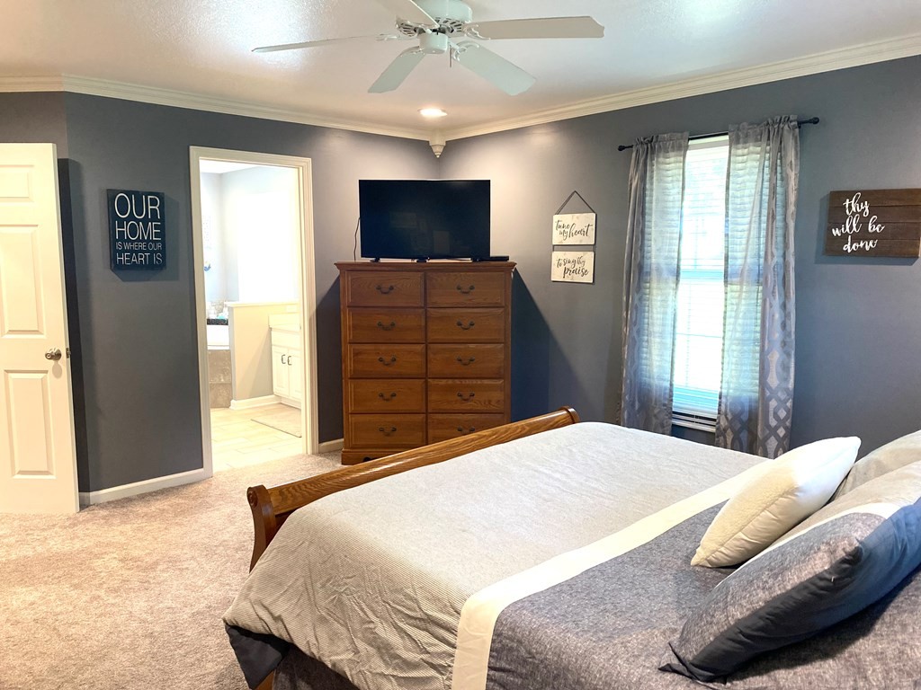 210 Clarks Store Sinking Fork Road Cerulean, KY 42215 - Photo 22 of 45 a bedroom with a bed and wooden floor