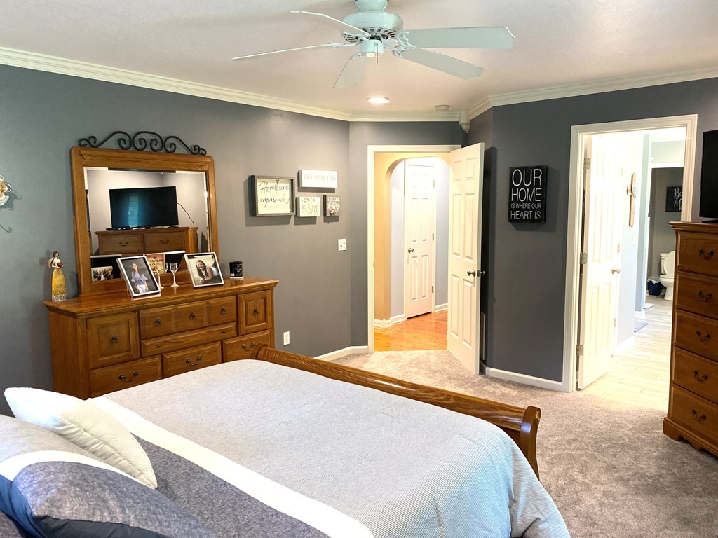 210 Clarks Store Sinking Fork Road Cerulean, KY 42215 - Photo 23 of 45 a bedroom with a bed and a flat screen tv