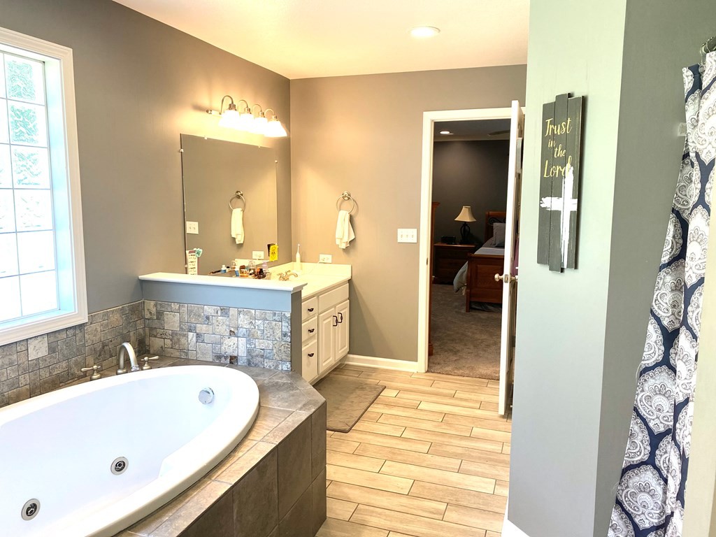 210 Clarks Store Sinking Fork Road Cerulean, KY 42215 - Photo 27 of 45 a bathroom with a bathtub and a sink